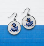 Douceur Nautique: Boucles d'Oreilles Canard en Faïence